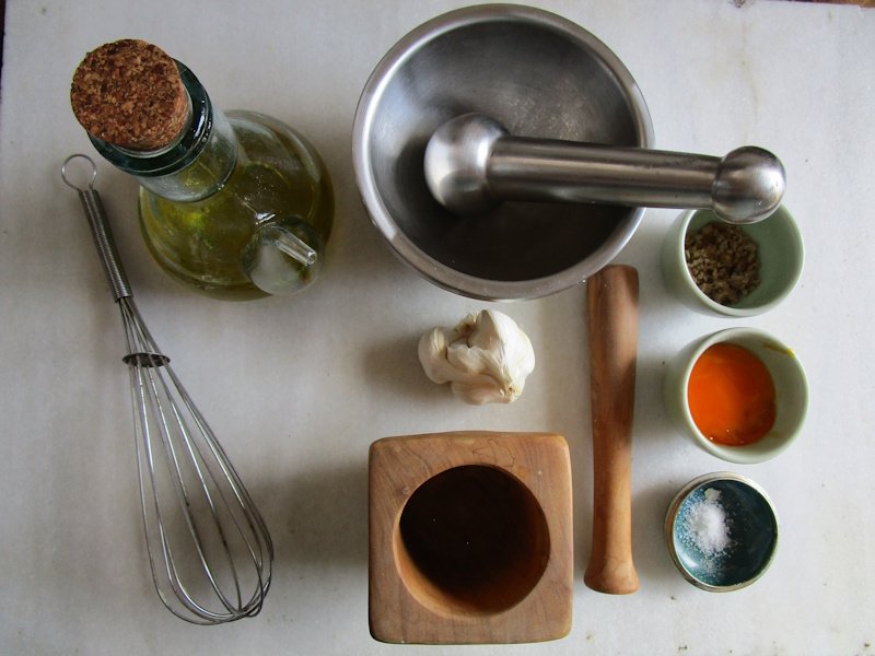 Pound skinned garlic cloves in a steel mortar with a heavy pestle for a fast smooth cream, but use a wooden mortar and pestle for making alioli and ajo as it reduces the risk of curdling. Pound skinned garlic cloves in a steel mortar with a heavy pestle for a fast smooth cream, but use a wooden mortar and pestle for making alioli and ajo as it reduces the risk of curdling.