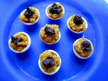 Saffroned sofrito, goat’s cheese, and black Empletre olive purée combine as a great filling for pastry tartlets.