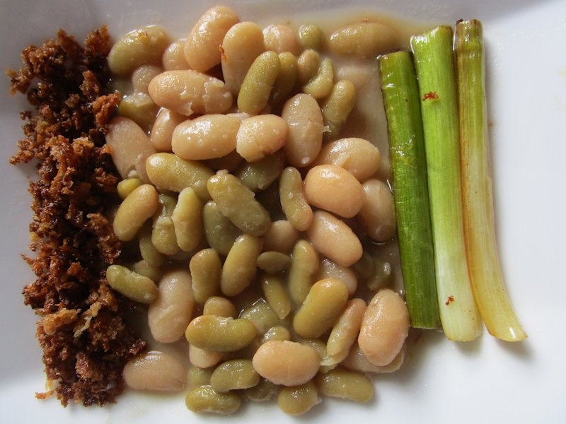 Braised dried beans, fried breadcrumbs and sweated green garlic.