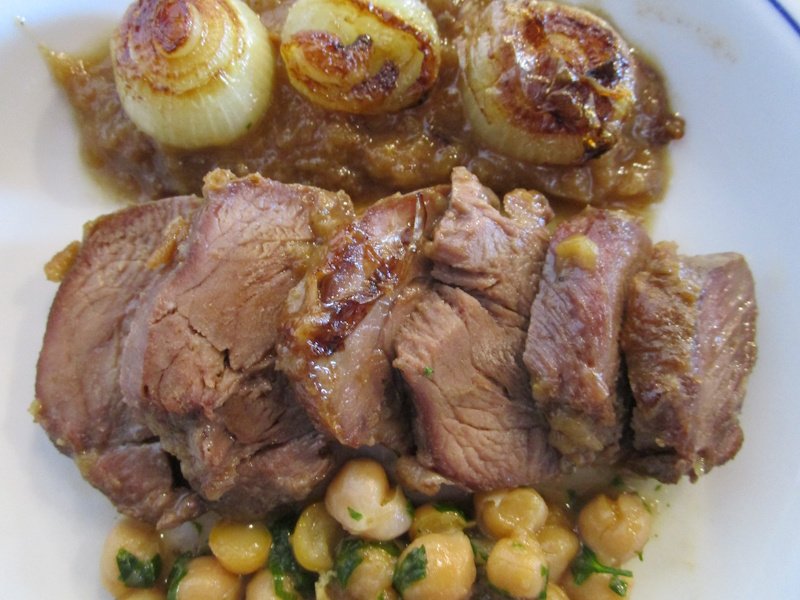 Beef cheeks, served carved and accompanied by braised onions and spiced chickpeas. Beef cheeks, served carved and accompanied by braised onions and spiced chickpeas.