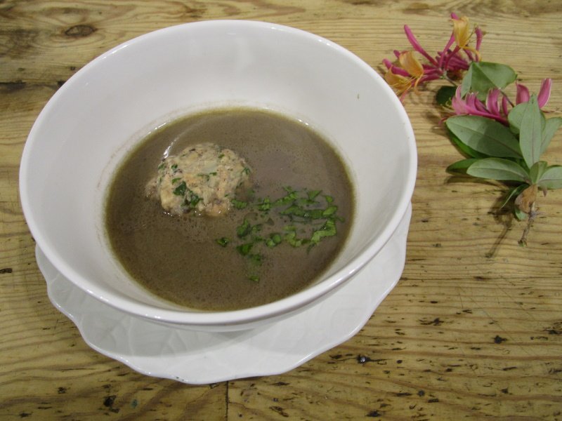 Sturgeon dumplings in broth, made here with fresh salmon and a home-made chickpea broth.