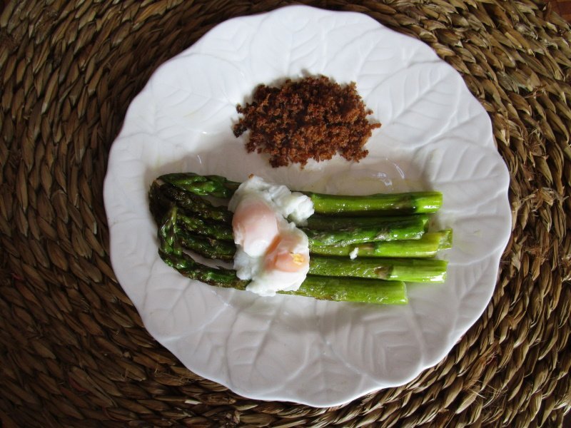 Spiced green asparagus, fried eggs and olive-oil fried breadcrumbs.