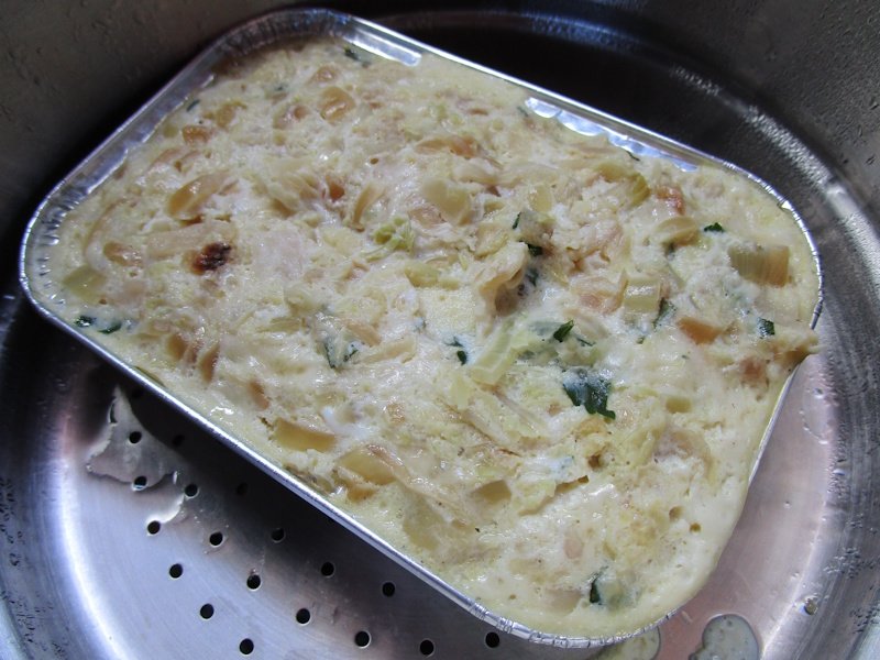 A large loaf-format custard, baked in a bain-marie, needs longer cooling as well as cooking time to reach a firm texture. A large loaf-format custard, baked in a bain-marie, needs longer cooling as well as cooking time to reach a firm texture.