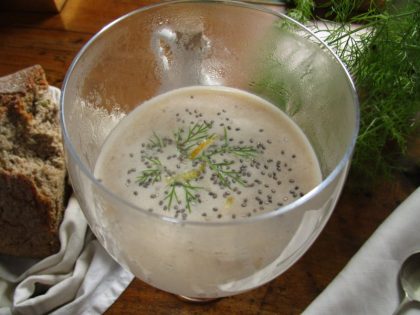 Hazelnut-thickened fish broth garnished with poppy seeds.