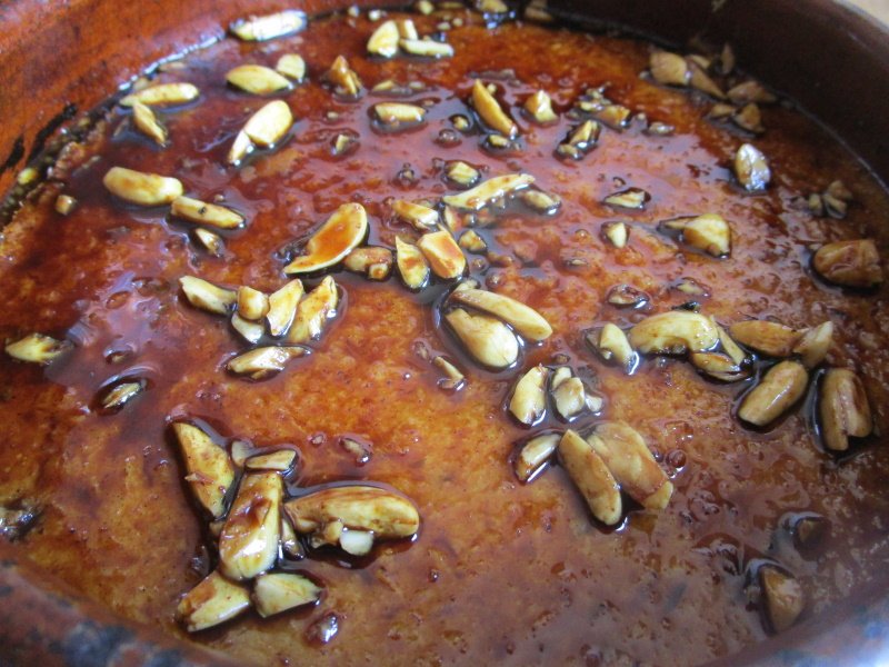 Crumb custard with a liquid caramel topping and toasted almonds.