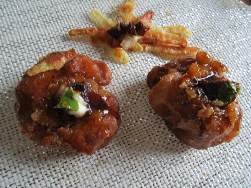 Fried spelt flour puffs with pear and marzipan filling and a honey-anise glaze.